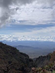 A view of mountains and clouds in the distance