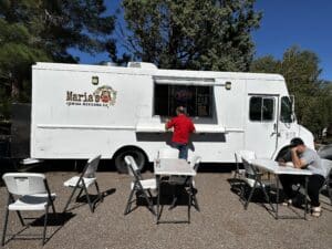 A patron ordering food outside of Maria's Food Truck