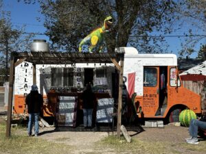 Tri La Bite food truck with customer in front