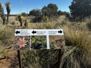 Sign at Chihuahuan Desert Research Center showing directions to the cactus museum, botanical garden and pollinator garden