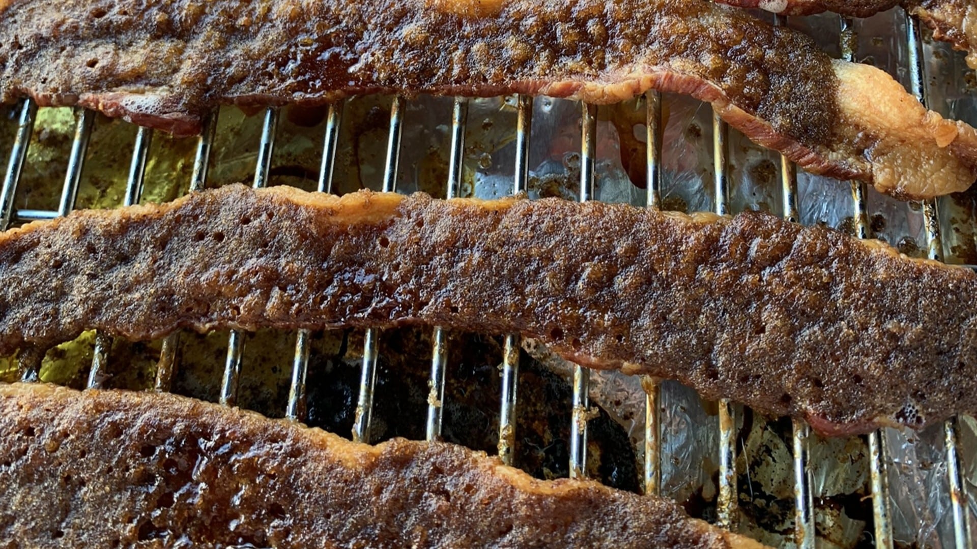 Cooked bacon on a rack
