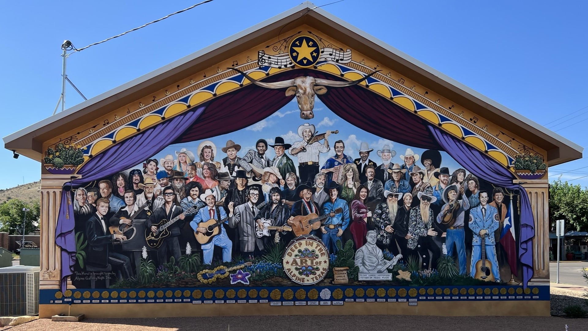Mural showing Texas music legends, local artists, and everything in between. This mural is displayed on the backside of Printco in Alpine Texas.
