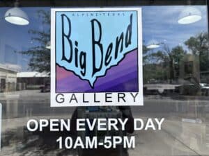 A picture of a glass dor that says Big Bend Gallery Open every Day 10 am - 5 pm