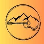 a drawn circle with a guitar morphing into a mountain in the center.